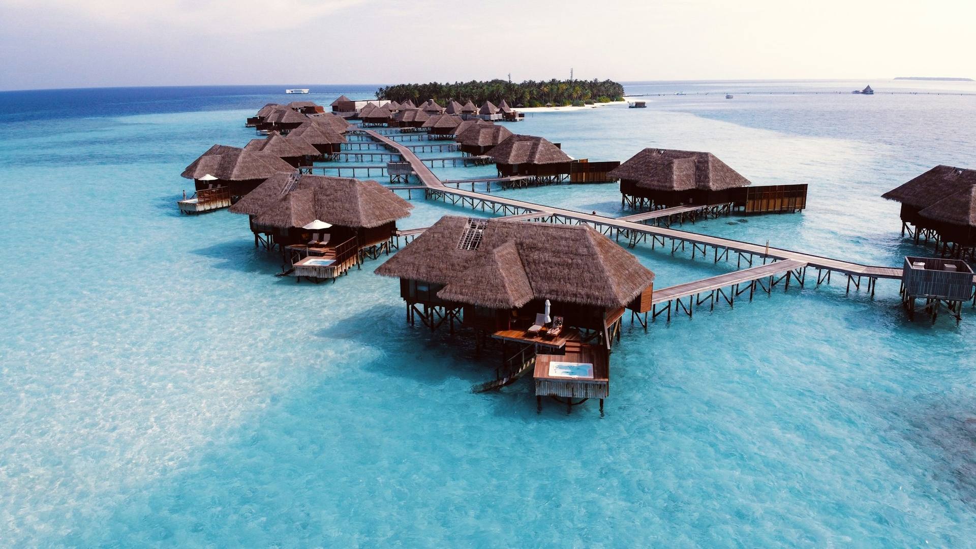 Overwater villas on a turquoise lagoon in the Maldives